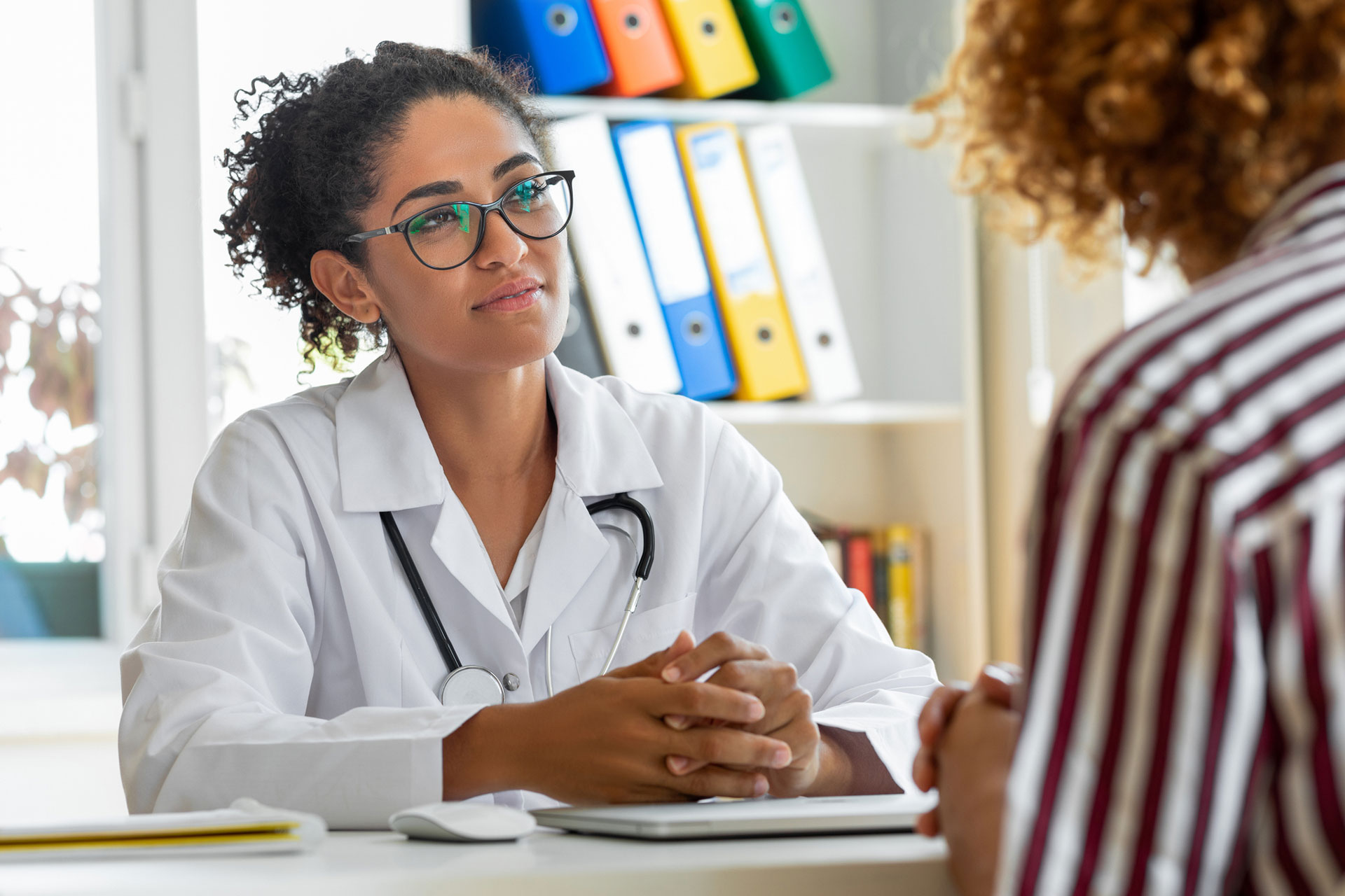 Female patient speaking with her doctors