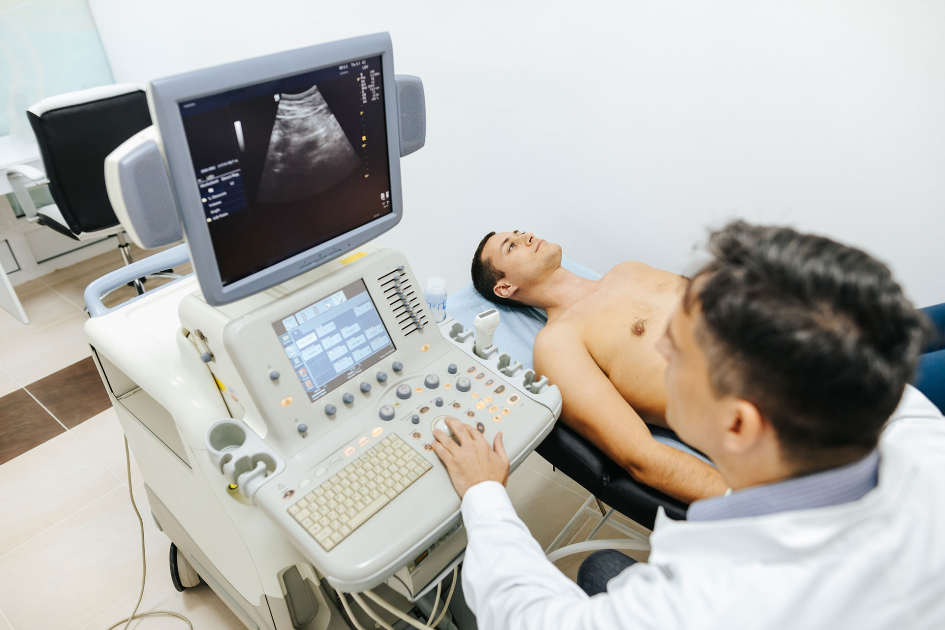 Young male patient having ultrasound examination