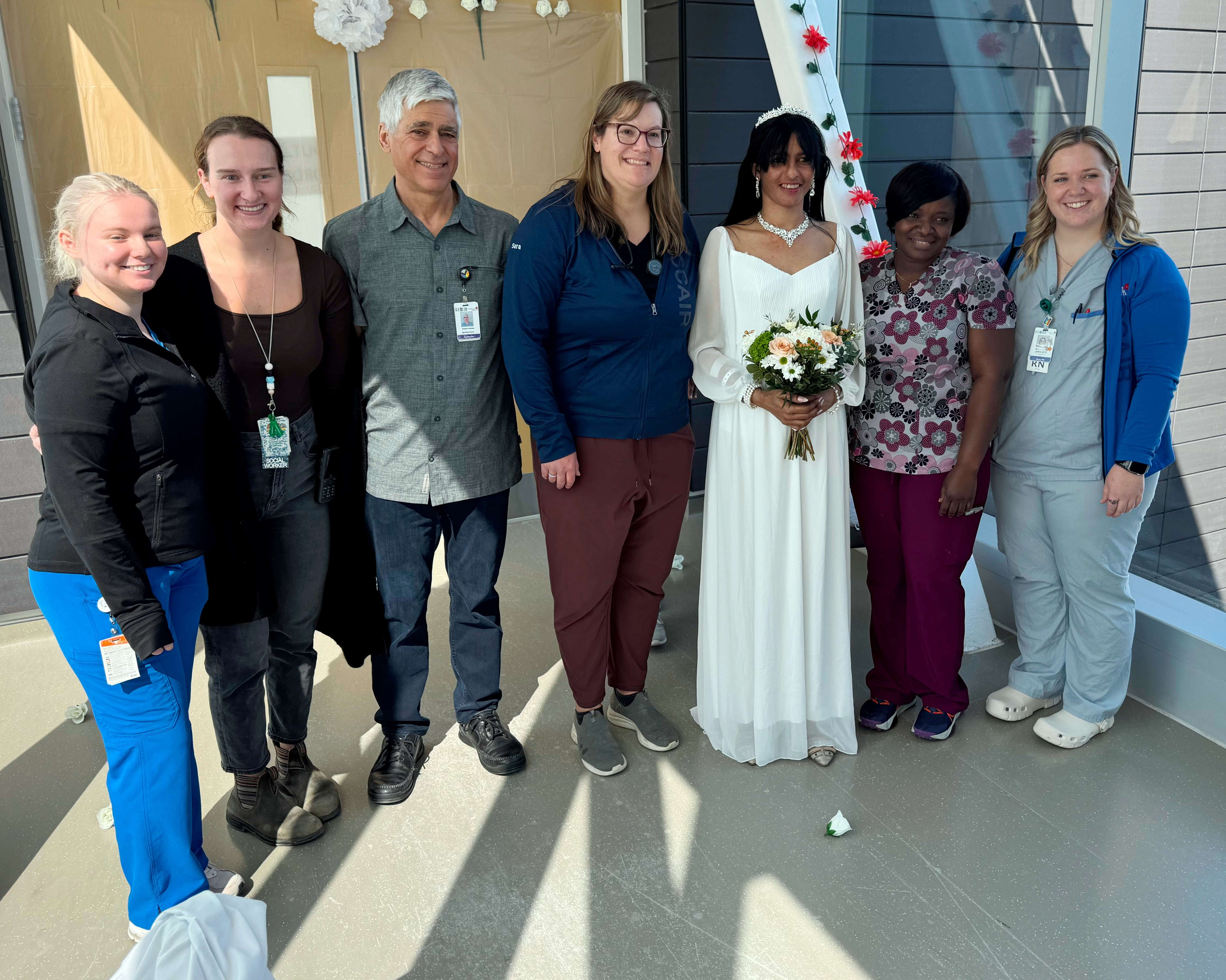 Alicia stands with CMH staff that helped make her wedding dream come true