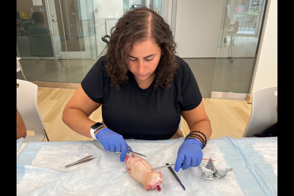 Romp student participates in suture clinic