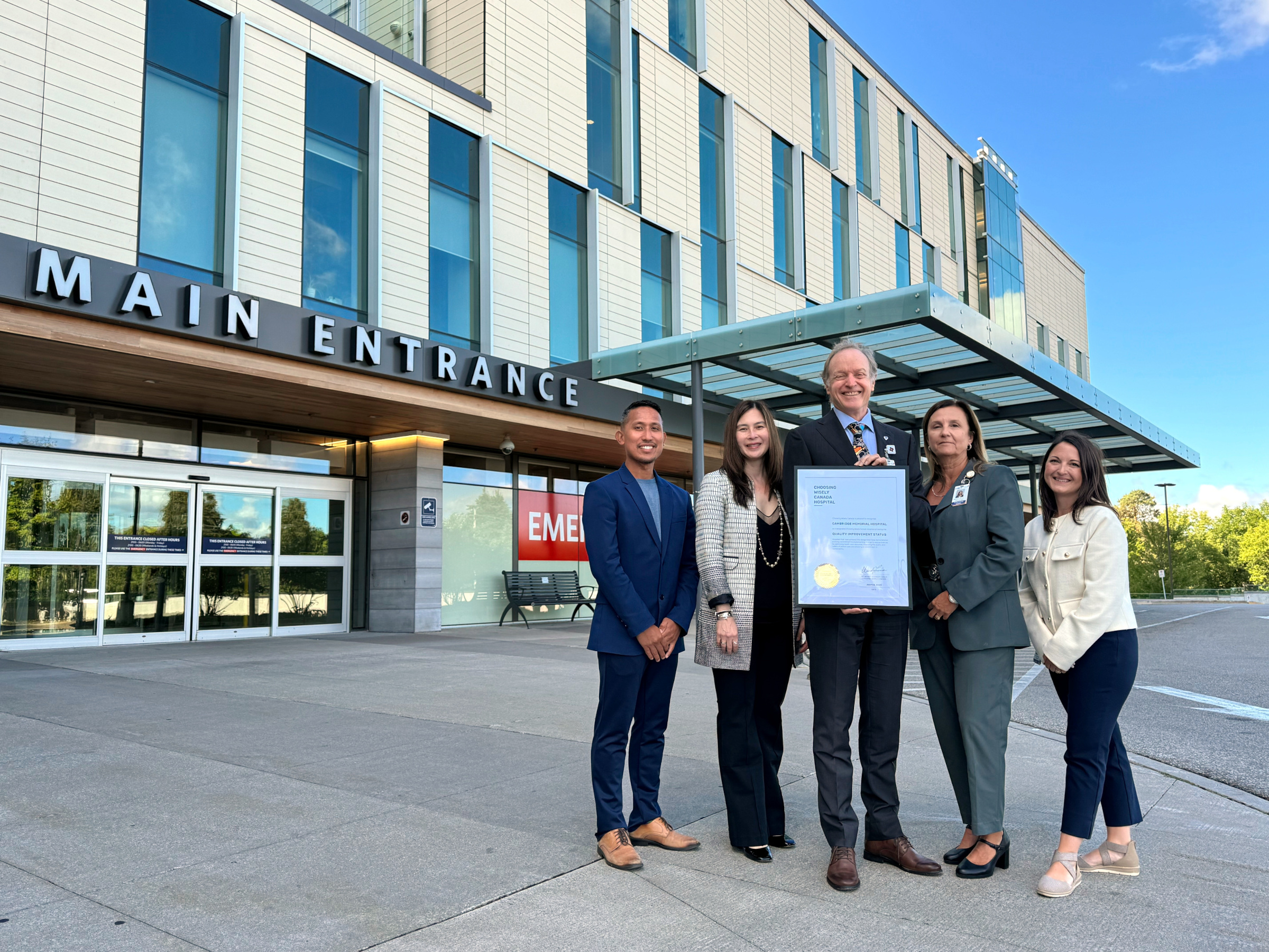 CMH executives and leaders stand in front of CMH holding the CWC designation for Quality Improvement status level
