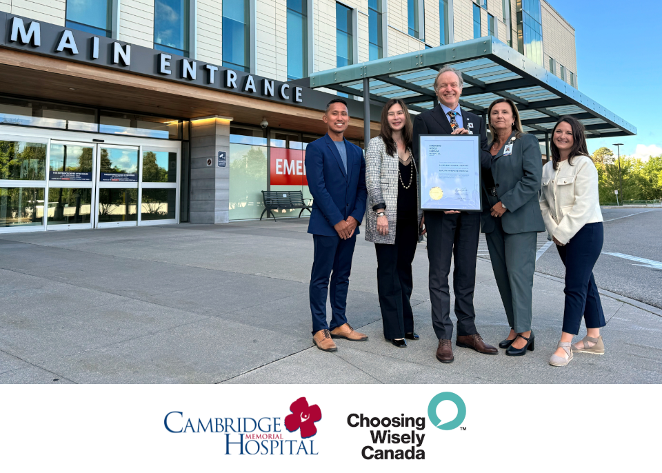 CMH executives and leaders stand in front of CMH holding the CWC designation for Quality Improvement status level, CMH logo and CWC logo at bottom