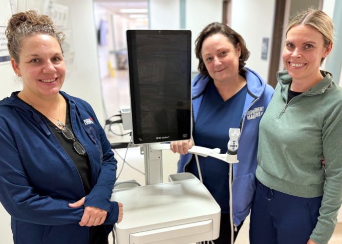 3 staff members stand beside new BDSite-Rite 9 Ultrasound Tech equipment