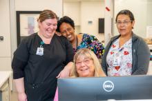 Picture of staff at a clerk's station in CMH